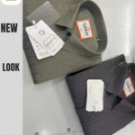 “Two folded men’s textured shirts in olive green and charcoal grey displayed on a white surface”