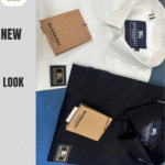 Two folded men’s textured shirts in olive green and charcoal grey displayed on a white surface”