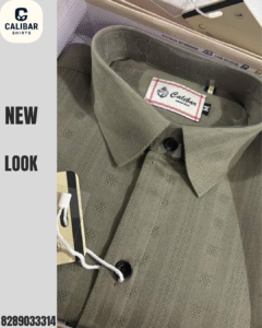 A premium olive green textured shirt from Calibar Shirts, neatly packed in a box and showcasing elegant detailing and buttons.