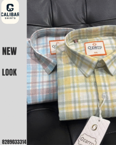 Two neatly folded check pattern shirts in pastel blue and yellow shades placed on a leather surface, representing a stylish new look collection.