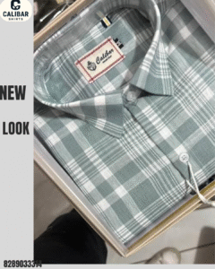 A folded light green and white check shirt displayed in a gift box, showcasing a refined and modern casual style.