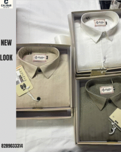 Calibar Shirts premium solid collection in beige, white, and olive colors displayed in boxes.